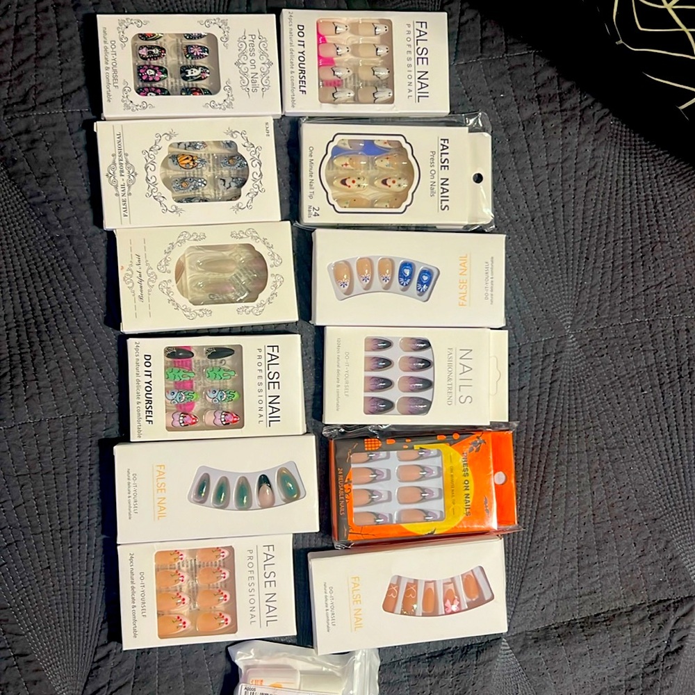 12 pairs of press on nails and a bottle of nail glue